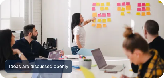 A team planning a release around a wall of sticky notes